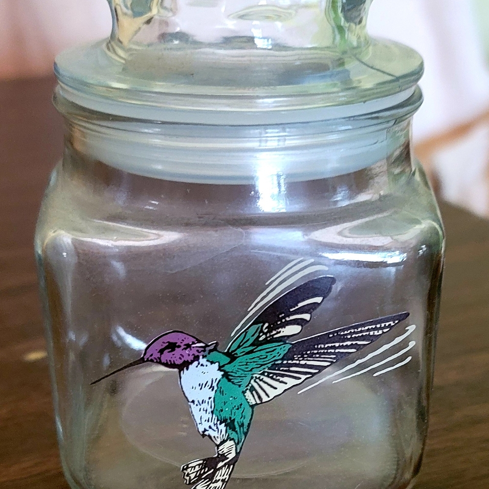 Small glass jar with hummingbird on front